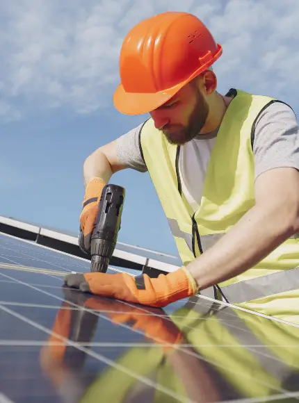 Solar installation specialist working on a photovoltaic panel